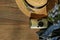 Woman trendy clothes, top view, flat lay. Summer hat, female denim, sunglasses and small camera, top view.