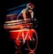 Woman triathlon triathlete cyclist cycling isolated black background