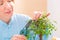 Woman trimming bonsai tree