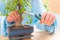 Woman trimming bonsai tree