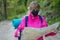 Woman on a trip or excursion with mask and backpack