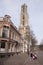 Woman with trolley passes the dom in utrecht