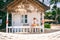 Woman tropical bungalow vacation on green background. Summer vacation. Beautiful sand beach.