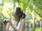 Woman In Tropical Forest Looking With Binoculars