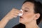 Woman Trying To Stop Nose From Bleeding