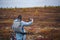 A woman in tundra enjoying scenery of colorful autumn in far north