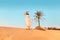 Woman in turban travels in Sahara desert. Adventure and life experience concept