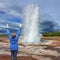 Woman - turist delighted geyser