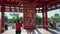 Woman turning Praying wheel in the Pagoda of Seven Days in Elista-city, Kalmyk Republic, Russia. Om mani padme hum