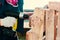 Woman twists a screw into a board with a screwdriver