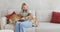 Woman and two cute akita inu dogs are playing at home in cozy comfortable living room.