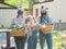 A woman with two daughters with food packages for the socially vulnerable segments of the population.