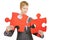 Woman with two red jigsaw puzzle pieces