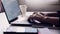 Woman typing keyboard laptop and account login screen on the working in the office on table background.