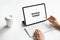 Woman typing keyboard laptop and tablet screen blank on the table mock up to promote your products.