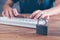 Woman typing on the keyboard next to the lock