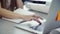 Woman typing letter on modern laptop kayboard