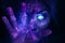 Woman in ultraviolet with glowing eyes and her hand up (Generative AI)