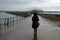 Woman with an umbrella on the pier of Saint-Malo in Brittany