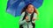 Woman, umbrella and rain weather by green screen for travel, adventure and thinking in cold with cover in mockup. Young