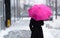 Woman with umbrella on snowy day