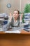 The woman under stress from excessive paper work