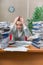 The woman under stress from excessive paper work