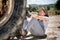 Woman under wheel of a truck, scared