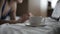 Woman in underwear surfing the internet with her laptop in a hotel room. Close up
