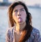 Woman with unhappy face, Cute Asian woman with long hair with funny upset face portrait