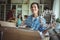 Woman unpacking cartons while family standing in background