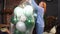 A woman unpacks balloons to decorate the room for the holiday.