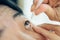 Woman use eye drop, artificial tears to the eye