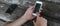 Woman use mobile phone in coffee shop from backside view.