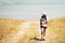 Woman use phone navigation outdoors to navigate on hiking trail to reach destination in caucasus mountains