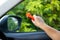 Woman use Safety Hammer and Seatbelt Cutter in Cars, break glass When emergency. In case of emergency on car safety red hammers to