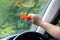 Woman use Safety Hammer and Seatbelt Cutter in Cars, break glass When emergency. In case of emergency on car safety red hammers to