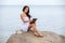 Woman use touch pad tablet pc internet technology sitting beach
