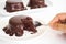 Woman used fork cutting chocolate cake with chocolate fudge on w