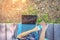 Woman using alcohol nano mist sprayer cleaning her hand before work with laptop to prevent the virus and bacterias. Quarantine for