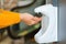 Woman using antiseptic gel. Coronavirus epidemic. Disinfection for hands in a shopping mall. Female applying a disinfectant for