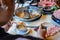 Woman using chopsticks and spoon eating Asian style seafood hotpot