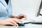 Woman using computer mouse and keyboard