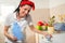 Woman using conditioner for washing machine