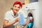 Woman using conditioner for washing machine