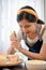 Woman using cream squeeze bag to decorating the cupcake, making cupcake