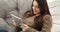 Woman using digital tablet on luxury chair