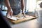 Woman using a dough scraper, making fresh dough at home