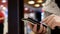 Woman using her mobile phone on beautiful blurred lighting background inside Mcdonalds restaurant