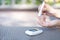 Woman using lancet on finger to check blood sugar level